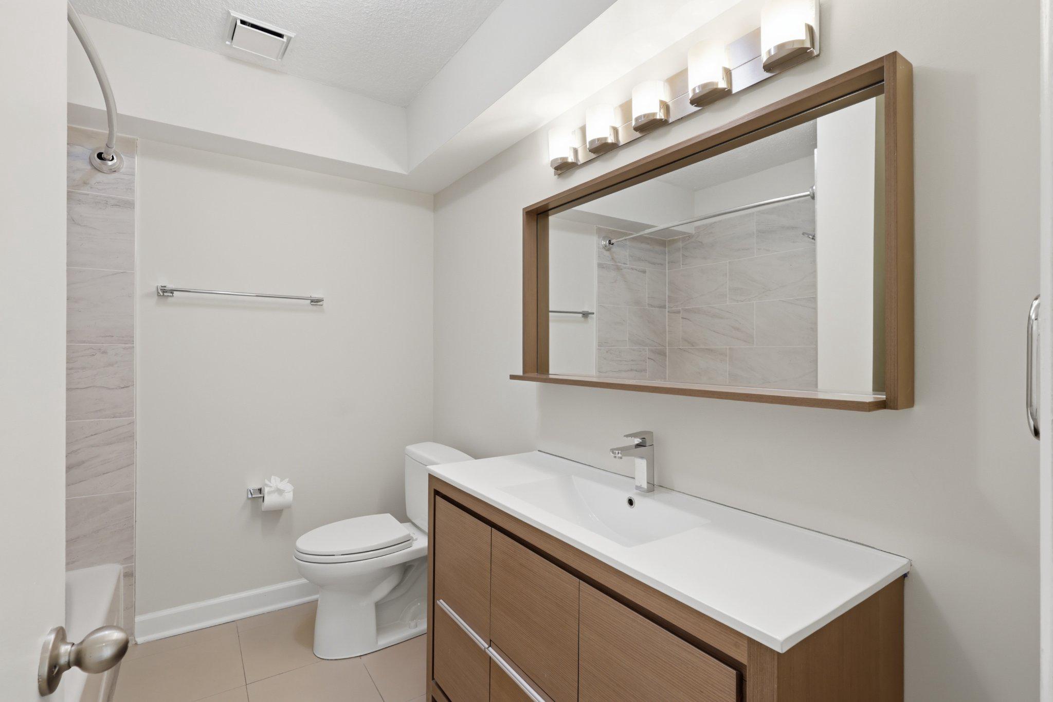 1101 St Paul Street, Unit 1212 Baltimore, MD 21202 - Photo 29 of 36 Modern hall bathroom with sleek finishes.