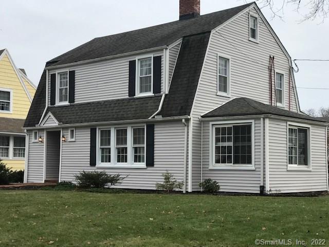 283 Old Spring Road Fairfield, CT 06824 - Photo 1 of 1 a front view of a house with a yard