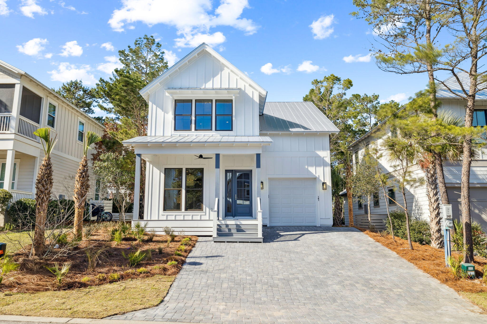 141 Grande Pointe Dr Inlet Beach Inlet Beach, FL 32461 - Photo 1 of 64 a view of a house with fountain in front of house