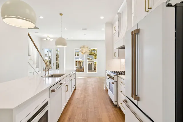a view of an entryway with wooden floor