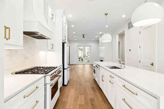 a view of a room with wooden floor fan and window