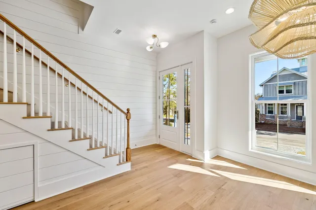 a bathroom with a toilet a sink and a mirror