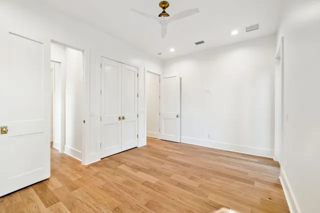 a view of a room with wooden floor