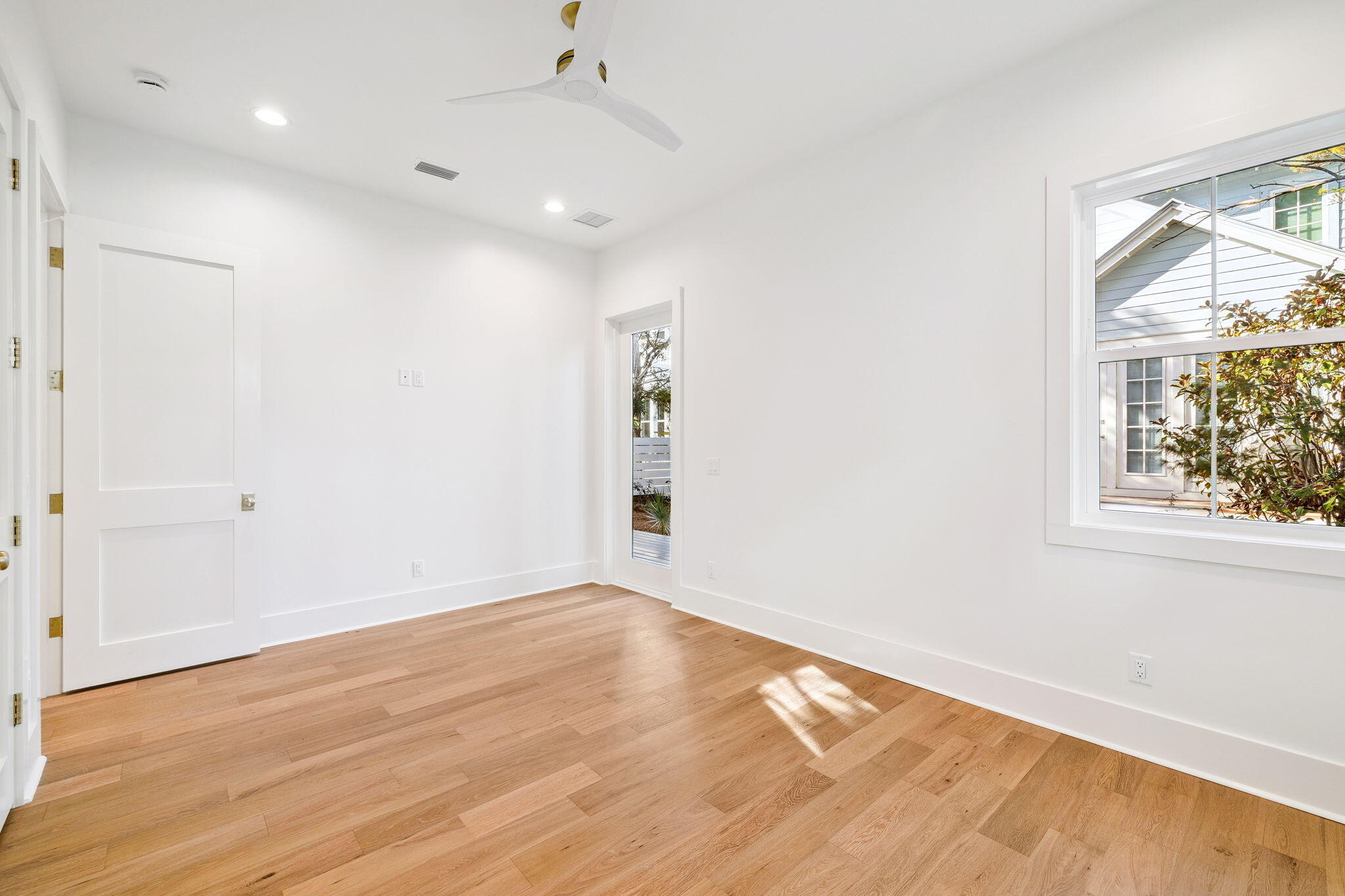 141 Grande Pointe Dr Inlet Beach Inlet Beach, FL 32461 - Photo 26 of 65 an empty room with wooden floor and windows