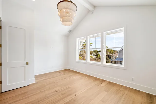 a bathroom with a double vanity sink a mirror and a shower