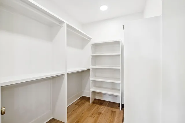 a bathroom with a sink a shower and a mirror