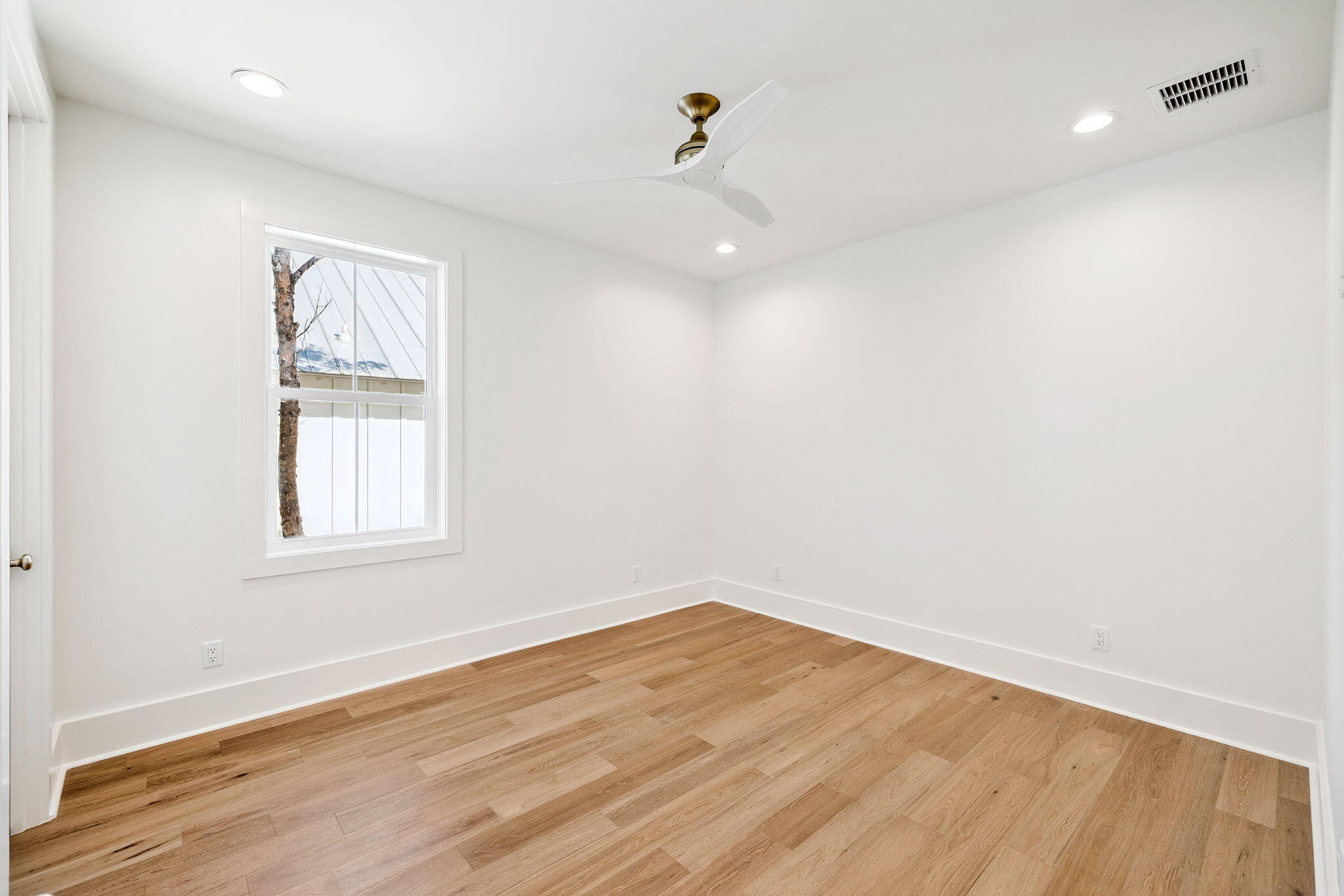 141 Grande Pointe Dr Inlet Beach Inlet Beach, FL 32461 - Photo 39 of 64 an empty room with wooden floor and windows