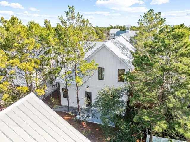 an aerial view of a house with outdoor space