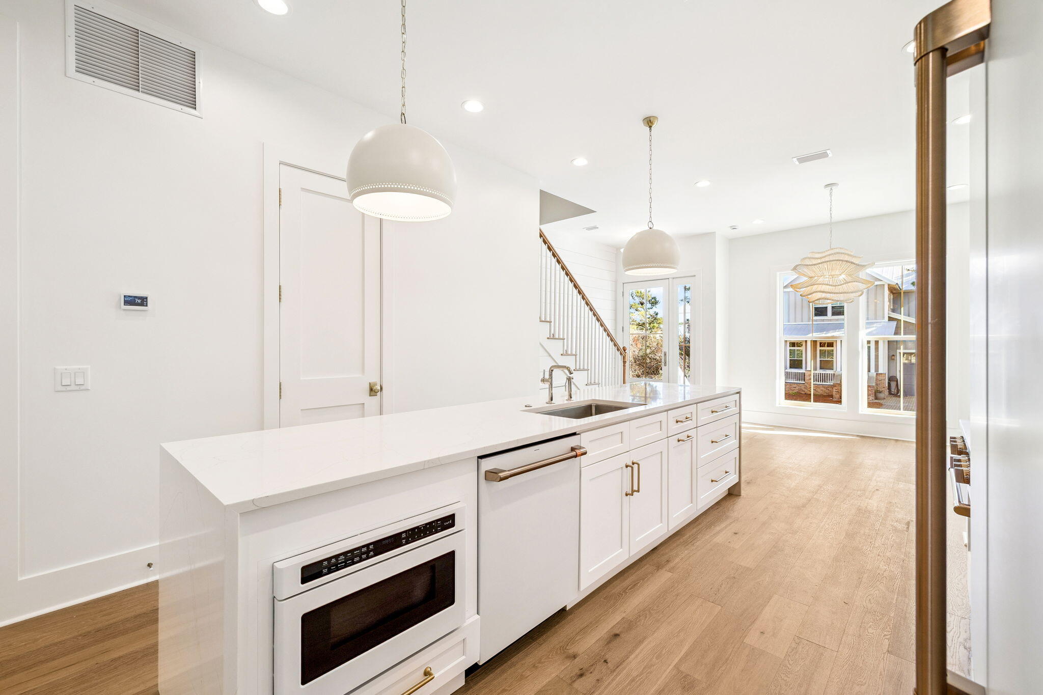 141 Grande Pointe Dr Inlet Beach Inlet Beach, FL 32461 - Photo 6 of 64 a kitchen with stainless steel appliances a stove and a chandelier