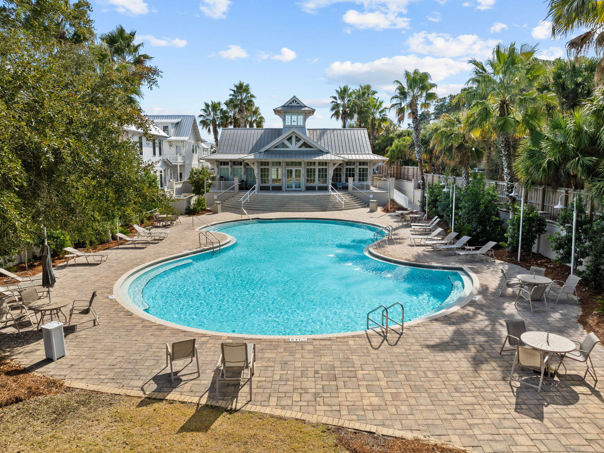 141 Grande Pointe Dr Inlet Beach Inlet Beach, FL 32461 - Photo 61 of 65 a view of a swimming pool with lawn chairs under an umbrella