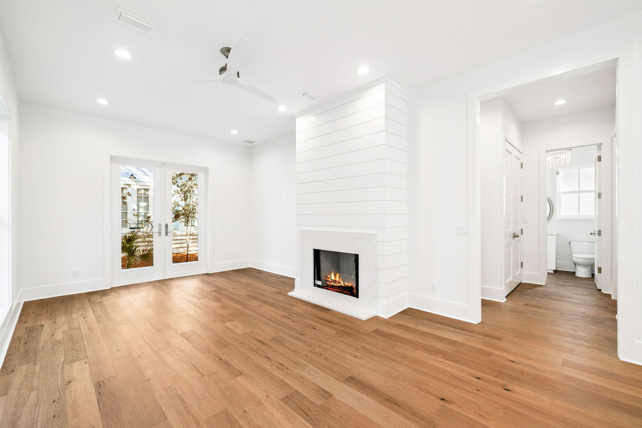 141 Grande Pointe Dr Inlet Beach Inlet Beach, FL 32461 - Photo 7 of 64 a view of an empty room with wooden floor and a fireplace