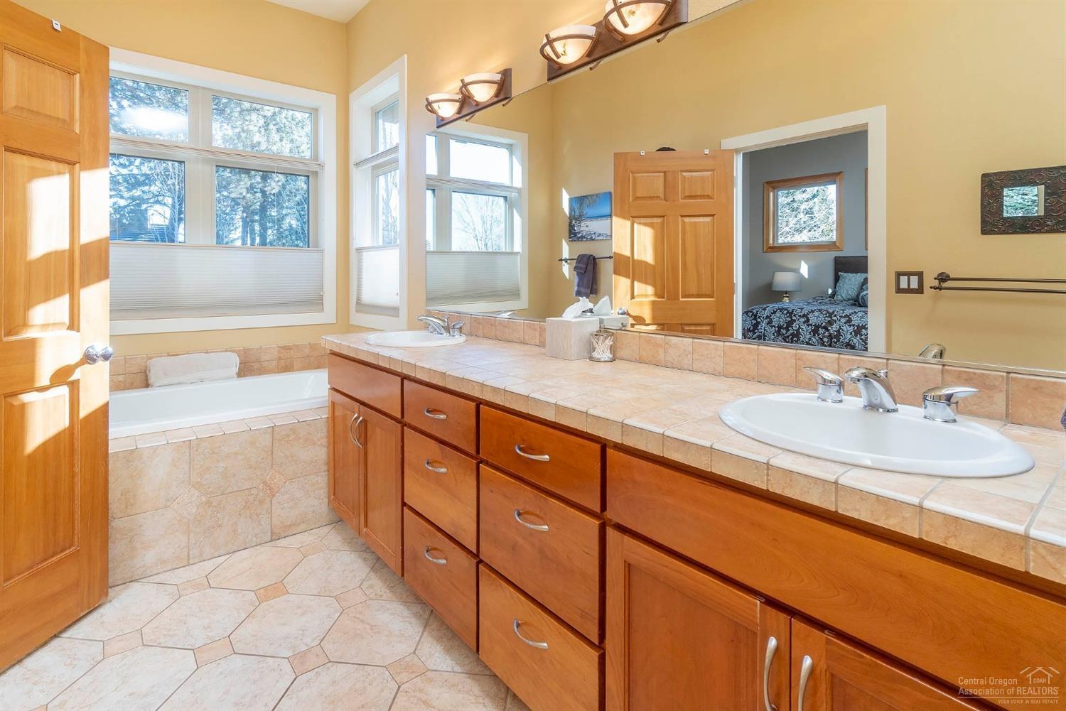 61842 Fall Creek Loop Bend, OR 97702 - Photo 11 of 22 Master bath features dual sinks, soaking