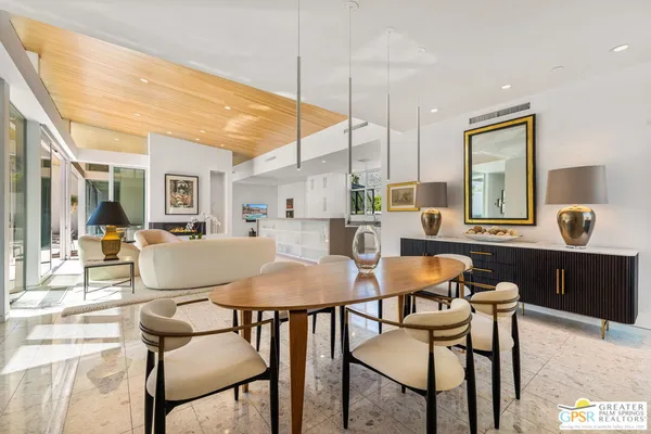 a kitchen with counter top space and living room