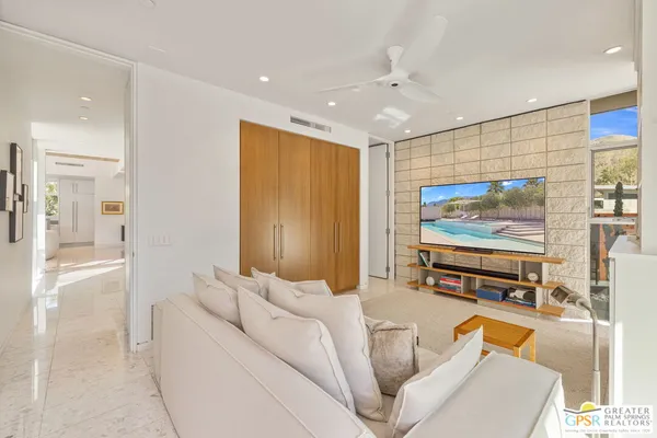 a view of a livingroom with furniture and a flat screen tv