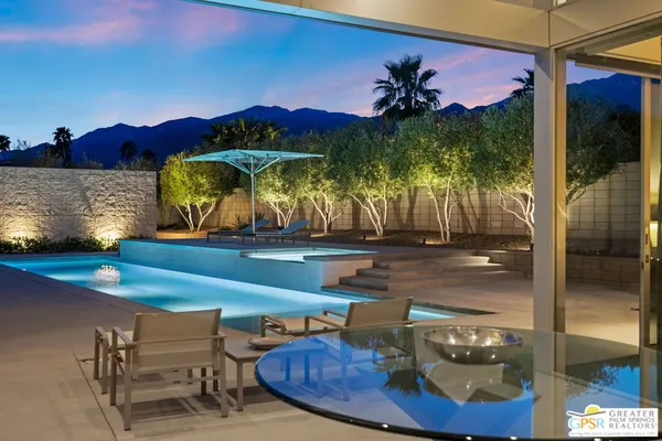 a view of a swimming pool with a patio