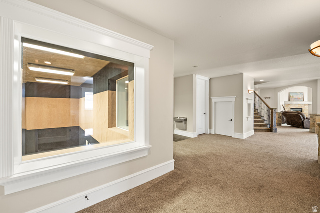 1205 North Elk Rdg Lane, Unit 202 Alpine, UT 84004 - Photo 43 of 88 Interior window featuring a soundproof room, broad white trim, and light wood-finish wall panels