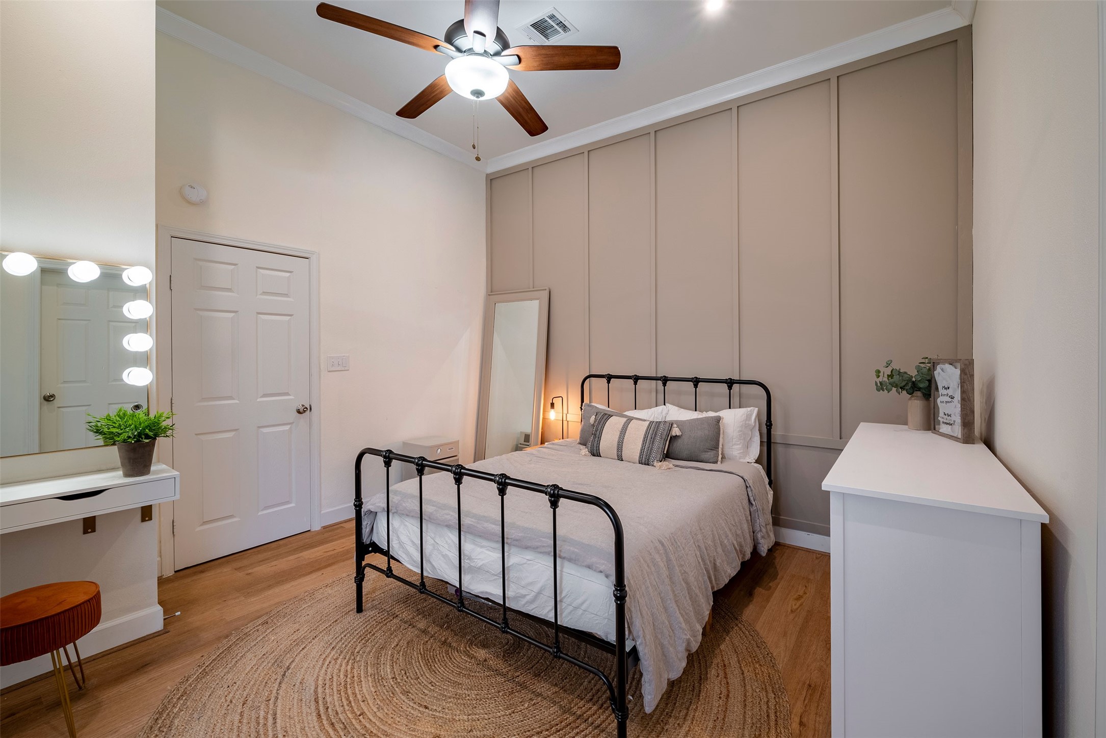 1924 Gano Street Houston, TX 77009 - Photo 13 of 18 a bedroom with a bed and a chandelier