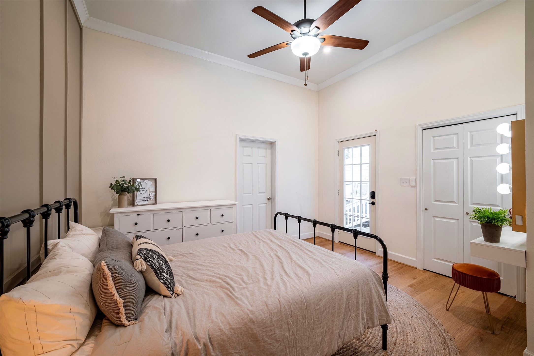 1924 Gano Street Houston, TX 77009 - Photo 14 of 18 a bedroom with a bed and a chandelier