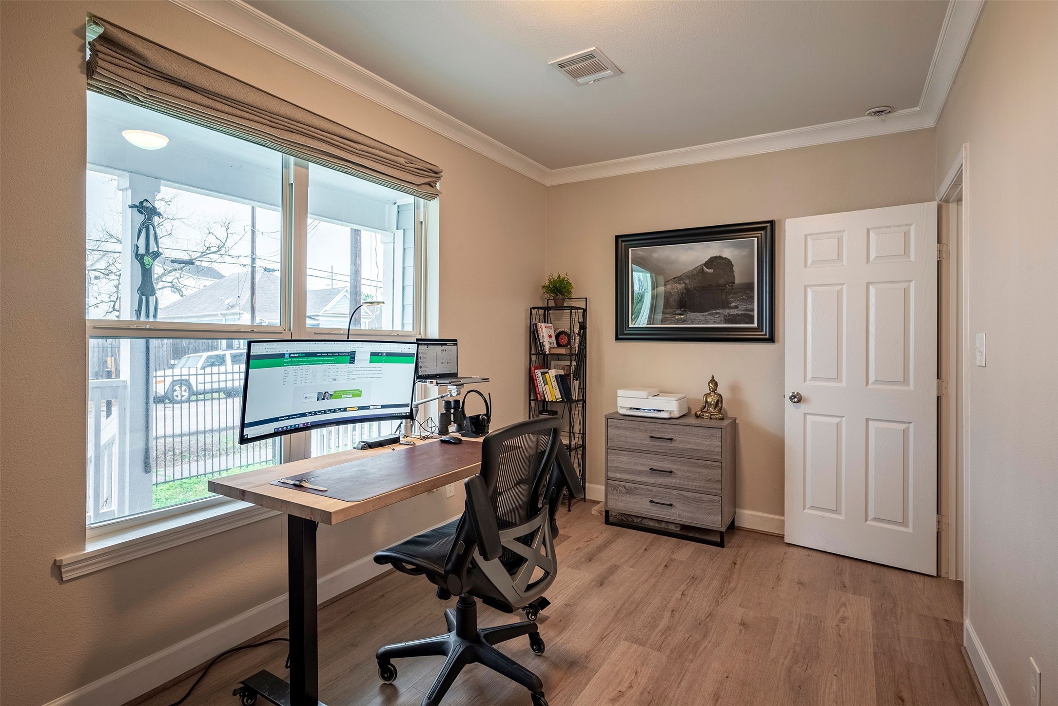 1924 Gano Street Houston, TX 77009 - Photo 16 of 18 a view of a workspace with furniture and a window