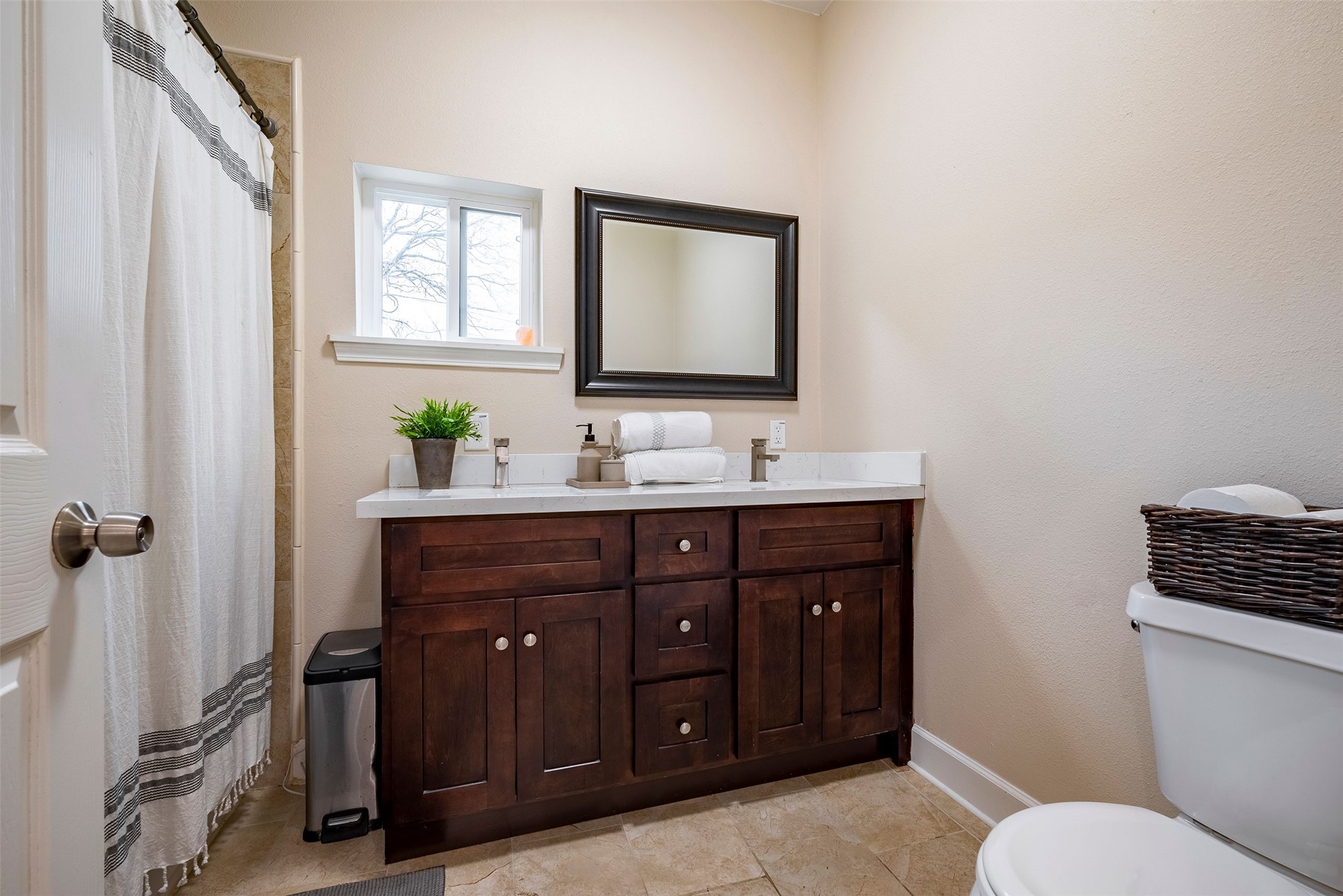 1924 Gano Street Houston, TX 77009 - Photo 18 of 18 a bathroom with a double vanity sink toilet and a mirror