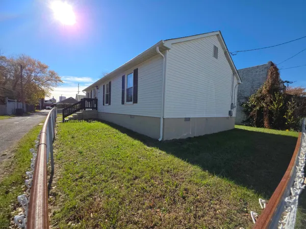 a view of a backyard of the house