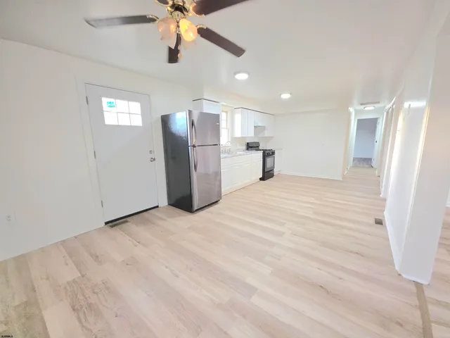 a kitchen with a refrigerator a sink and dishwasher