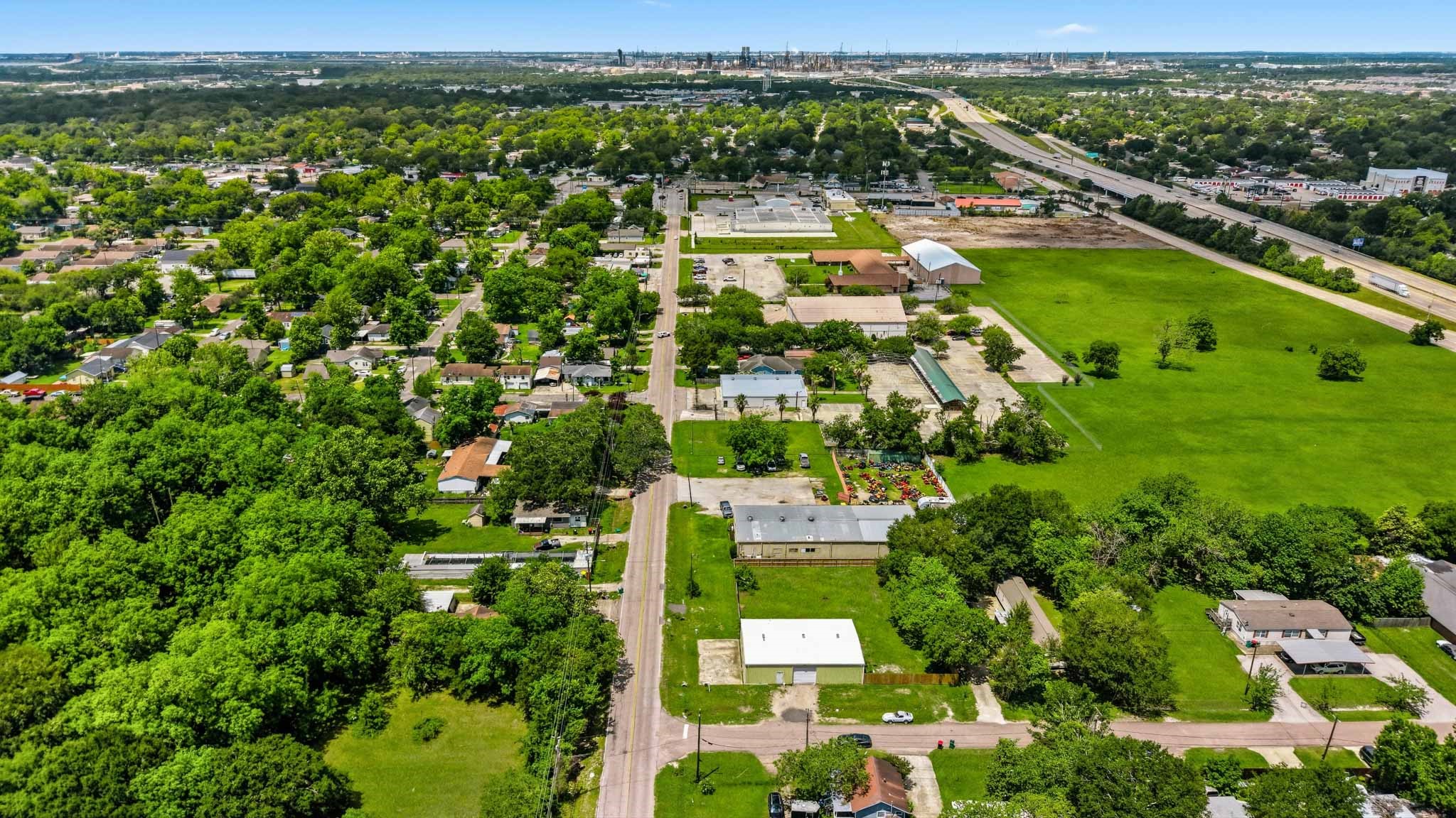 516 Cedar Bayou Road Baytown, TX 77520 - Photo 14 of 16 an aerial view of residential houses with outdoor space and swimming pool