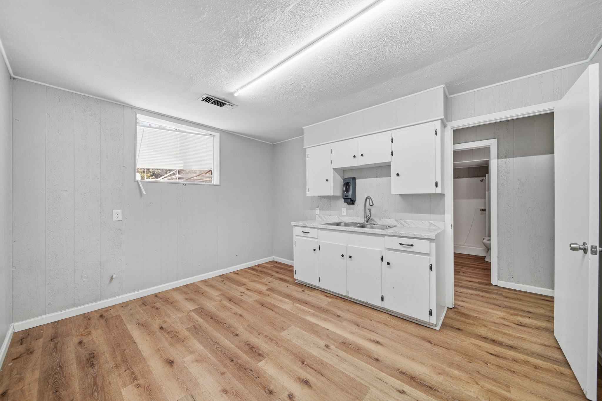 516 Cedar Bayou Road Baytown, TX 77520 - Photo 5 of 16 a room with a granite countertop sink mirror and vanity