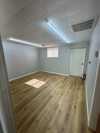 a room with a bed and furniture