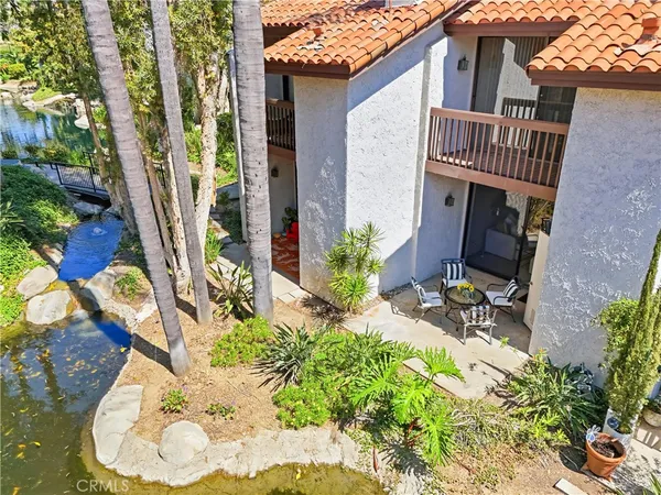 a view of a backyard with potted plants