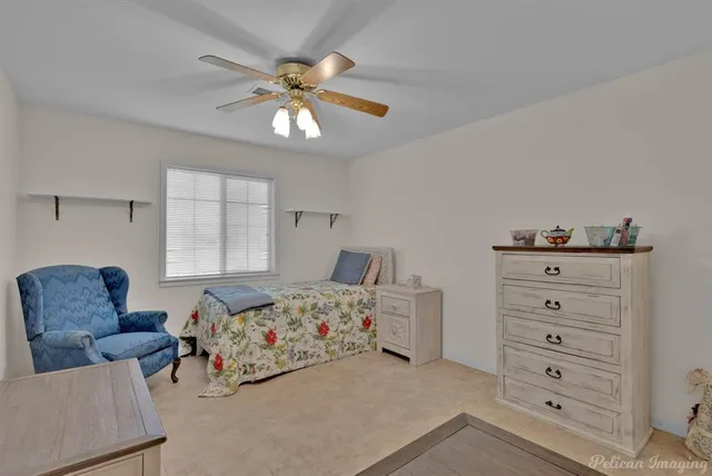 a bedroom with a bed and a couch