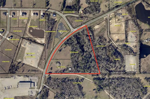 a view of water heater room with wooden floor