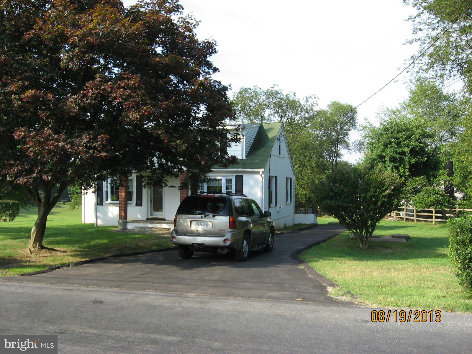315 Bryants Nursery Road Silver Spring, MD 20905 - Photo 2 of 24 a front view of a house with garden