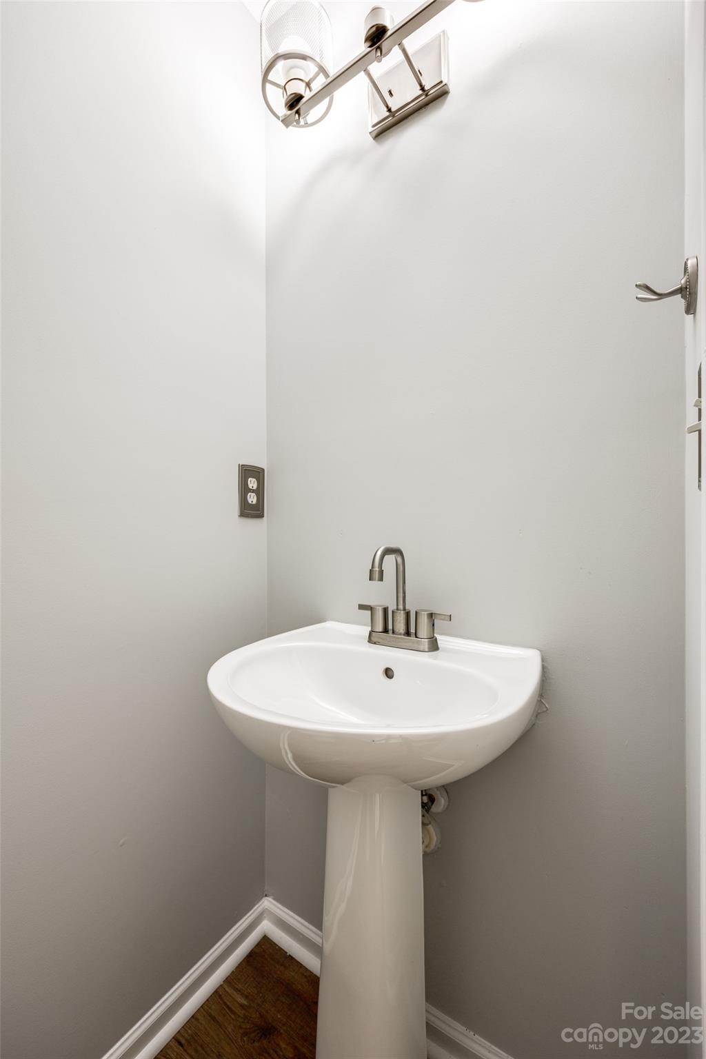 413 Caddy Street Fort Mill, SC 29715 - Photo 12 of 26 a bathroom with a sink a mirror and a toilet