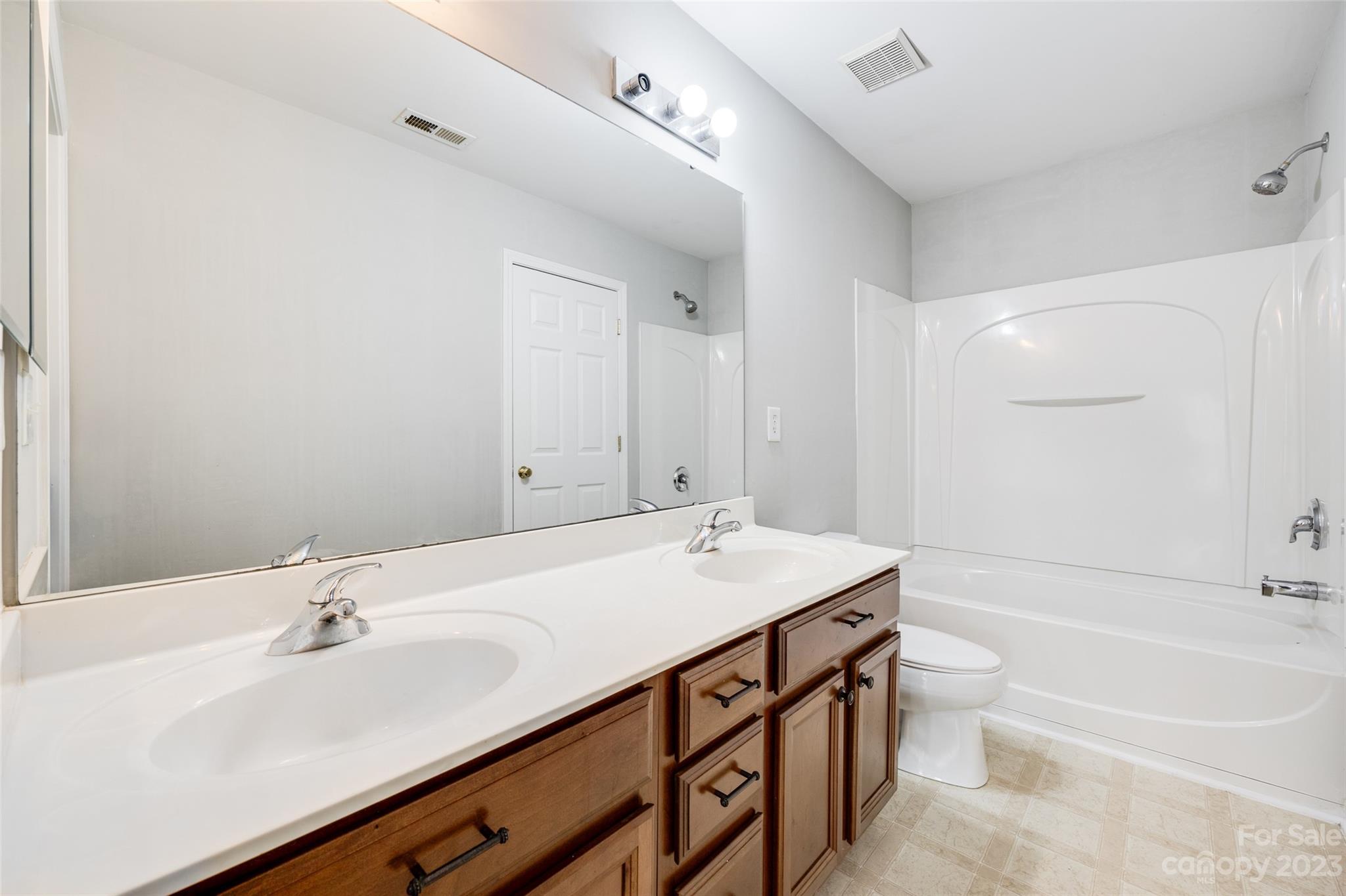 413 Caddy Street Fort Mill, SC 29715 - Photo 15 of 26 a bathroom with a sink a toilet and shower