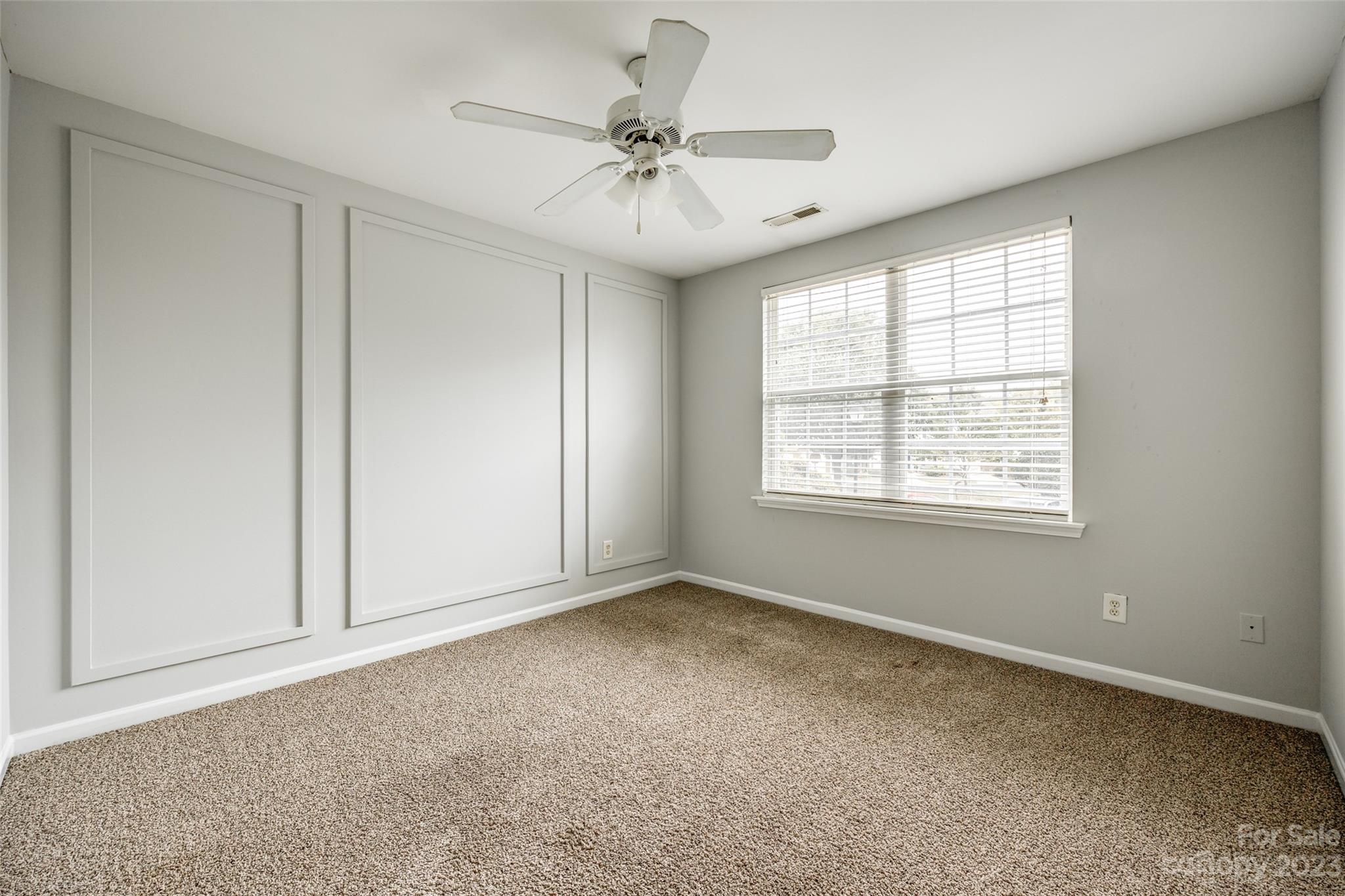 413 Caddy Street Fort Mill, SC 29715 - Photo 17 of 26 an empty room with fan and windows