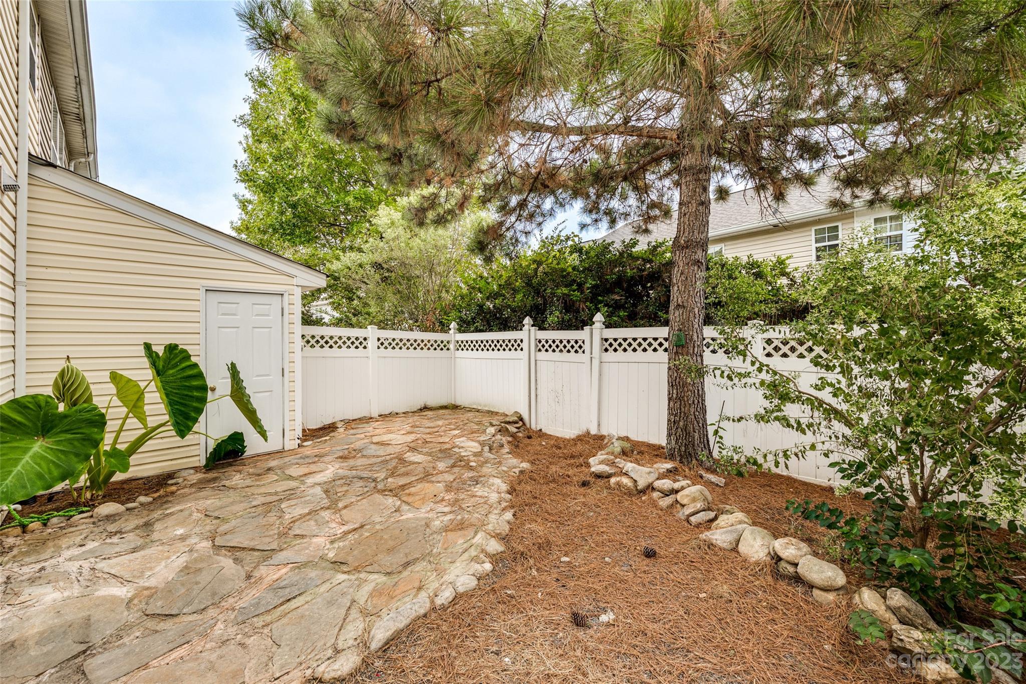 413 Caddy Street Fort Mill, SC 29715 - Photo 24 of 26 a view of a house with a yard and sitting area