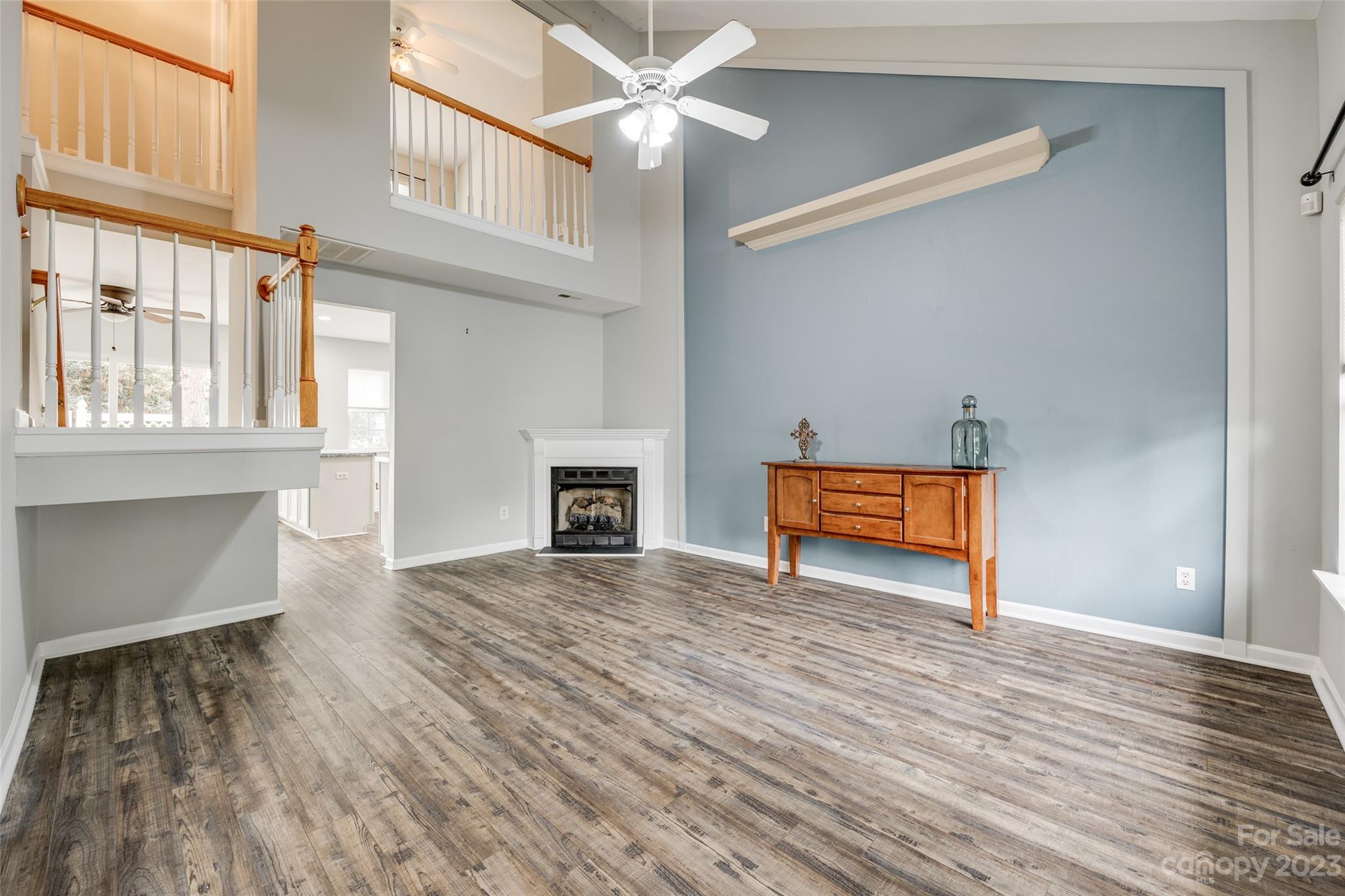 413 Caddy Street Fort Mill, SC 29715 - Photo 4 of 26 a view of an empty room with wooden floor and a window