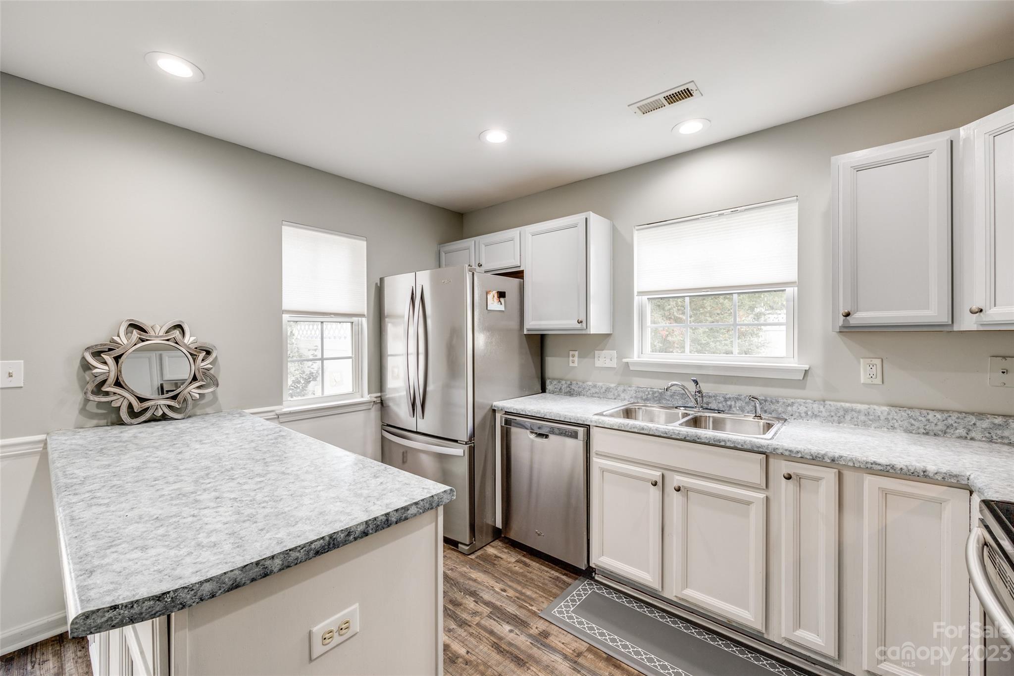 413 Caddy Street Fort Mill, SC 29715 - Photo 9 of 26 a kitchen with a sink stove and refrigerator