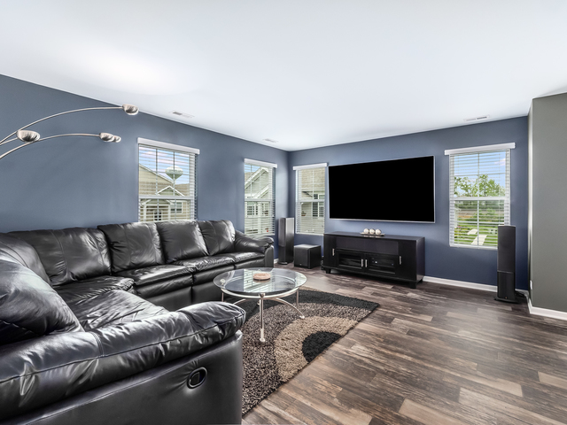 2421 Upland Road Pingree Grove, IL 60140 - Photo 2 of 21 a living room with furniture and a flat screen tv