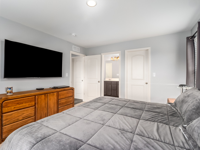 2421 Upland Road Pingree Grove, IL 60140 - Photo 11 of 21 a bedroom with a flat screen television and a bed