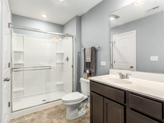 2421 Upland Road Pingree Grove, IL 60140 - Photo 12 of 21 a bathroom with a sink toilet and shower