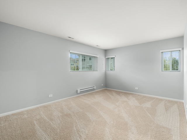 2421 Upland Road Pingree Grove, IL 60140 - Photo 16 of 21 a view of an empty room with a window