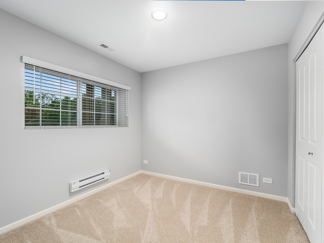 2421 Upland Road Pingree Grove, IL 60140 - Photo 18 of 21 a view of an empty room with a window