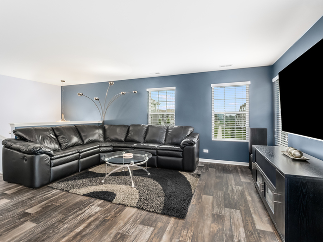 2421 Upland Road Pingree Grove, IL 60140 - Photo 6 of 21 a living room with furniture and a flat screen tv