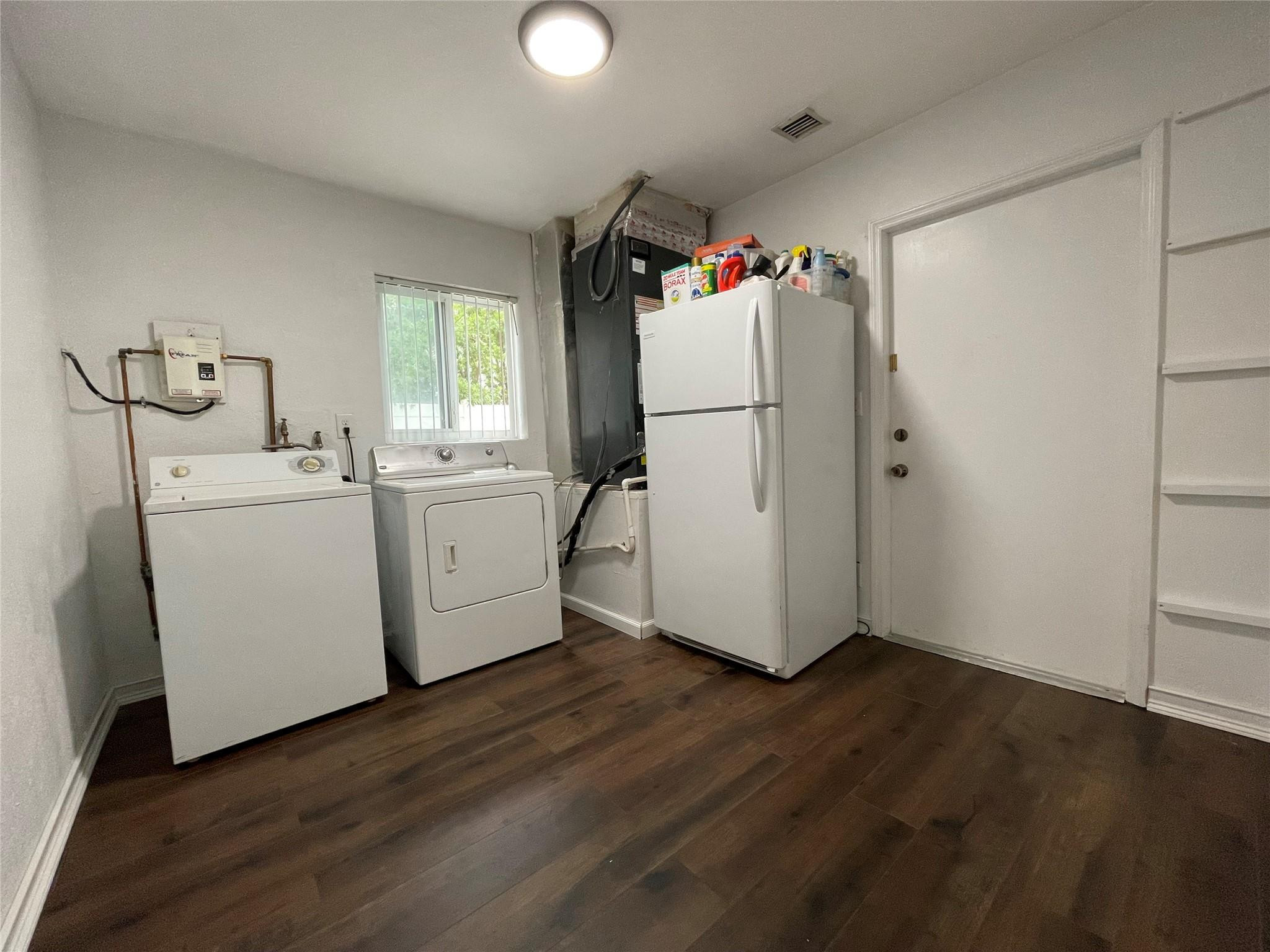 3231 Northeast 27th Terrace Lighthouse Point, FL 33064 - Photo 21 of 30 a utility room with dryer and washer