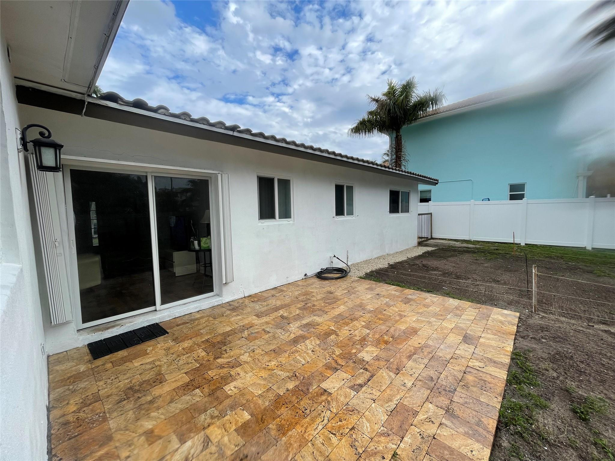 3231 Northeast 27th Terrace Lighthouse Point, FL 33064 - Photo 25 of 30 a view of a house with a yard