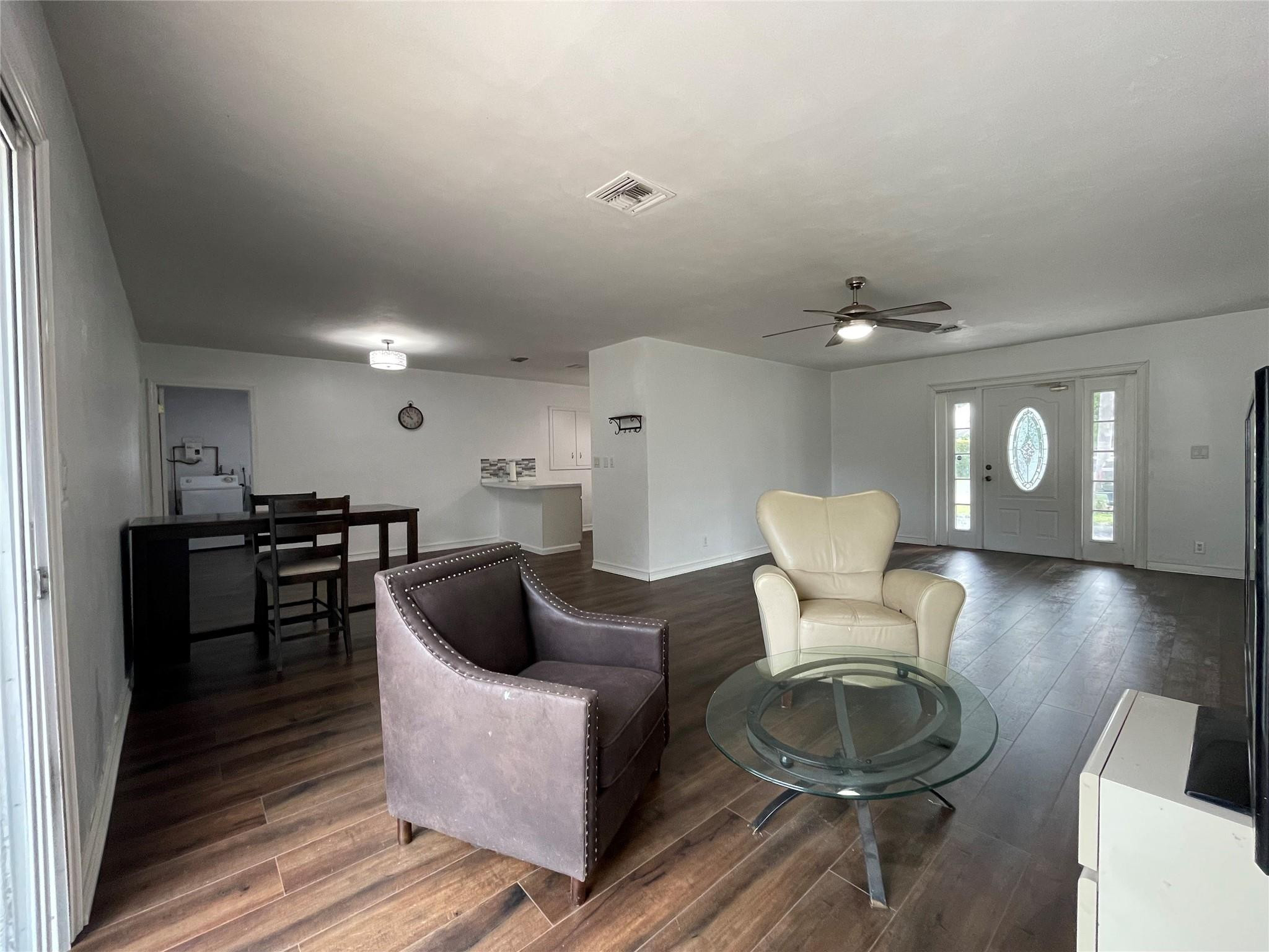 3231 Northeast 27th Terrace Lighthouse Point, FL 33064 - Photo 10 of 30 a living room with furniture and a wooden floor