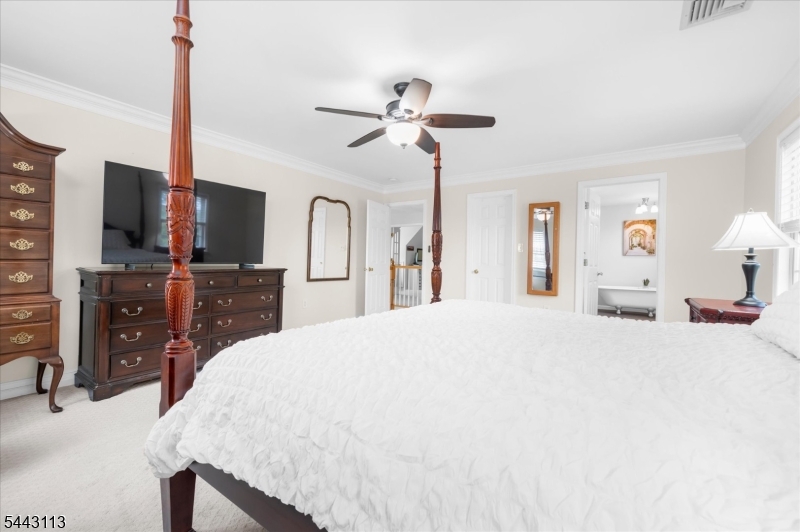54 Rick Road Milford, NJ 08848 - Photo 35 of 50 a bed room with a bed a television and dresser