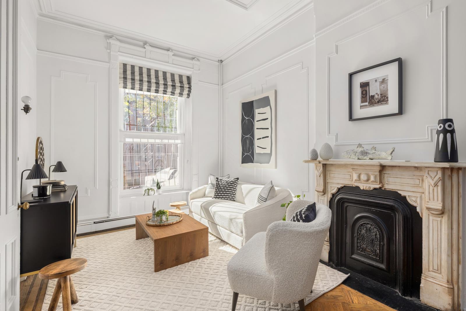 a living room with furniture a flat screen tv and a fireplace